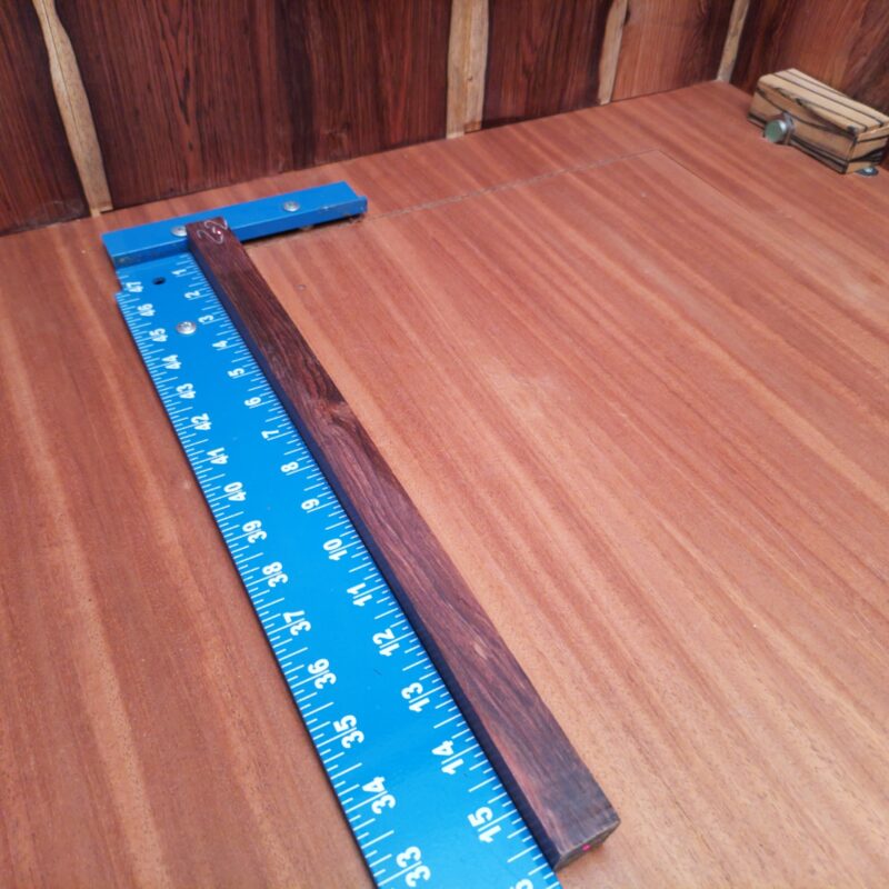 Honduran Rosewood brings sophistication to your life! Whether you opt for luxury drawer pulls or custom cutting boards, your home will exude elegance. Handcrafted cocktail stirrers add a dash of style, while bespoke game pieces keep family night exciting! And don't forget to adorn your walls with wooden picture frames that showcase your best moments or a sculptural desk ornament that says, 'look at me!' This piece of Honduran Rosewood measures 0.9 inches by 0.9 inches by 15.8 inches, offering a high-quality option for a variety of woodworking projects.