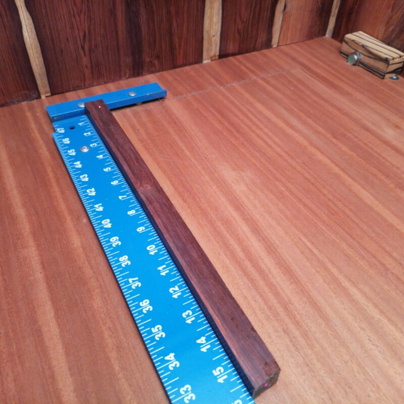 Honduran Rosewood brings sophistication to your life! Whether you opt for luxury drawer pulls or custom cutting boards, your home will exude elegance. Handcrafted cocktail stirrers add a dash of style, while bespoke game pieces keep family night exciting! And don't forget to adorn your walls with wooden picture frames that showcase your best moments or a sculptural desk ornament that says, 'look at me!' This piece of Honduran Rosewood measures 0.9 inches by 0.9 inches by 15.8 inches, offering a high-quality option for a variety of woodworking projects.