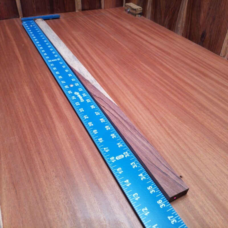 Dimensional Lumber 125 With a slender profile, Honduran Rosewood helps forge a world of luxurious guitar fretboards, chic knife handles, and custom drawer pulls. Imagine crafting eye-catching picture frames or even elegant bookmarks that make boring stories look good! You're not just crafting wood; you're creating stories, art, and a little sprinkle of extravagance with every twist and turn of your project! This piece of Honduran Rosewood measures 0.5 inches by 1.2 inches by 36.0 inches, offering a high-quality option for a variety of woodworking projects.