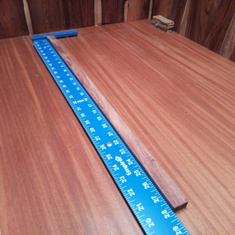 Dimensional Lumber 131 Unleash your creativity with this stunning piece of wood! Whether you’re crafting a custom guitar neck, designing elegant drawer pulls, or even creating an artistic wall sculpture, the possibilities are endless! Make your home snazzier with chic serving trays or stylish napkin holders that’ll impress anyone at dinner. Really, with this high-end material, you can build a whole world—just remember to share a piece or two! This piece of Honduran Rosewood measures 0.6 inches by 0.9 inches by 27.8 inches, offering a high-quality option for a variety of woodworking projects.