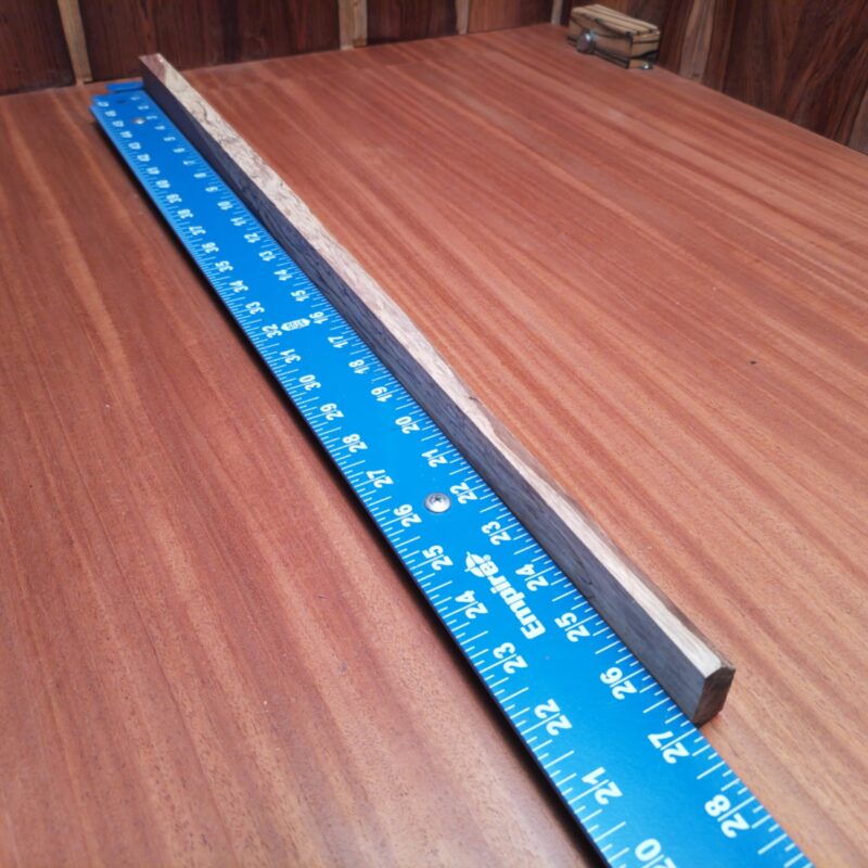 Introducing the Honduran Rosewood G2: a versatile masterpiece! With it, you could carve out a luxury guitar neck, sculpt a stunning art piece, or even create one-of-a-kind chopsticks. Maybe you want it for decorative bookmarks or that fancy minimalist desk organizer? The possibilities are endless, just like my love for wood! This piece of Honduran Rosewood measures 0.7 inches by 1.2 inches by 26.8 inches, offering a high-quality option for a variety of woodworking projects.