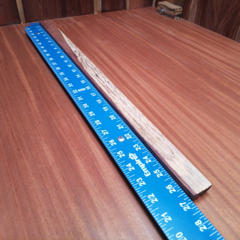 Introducing the Honduran Rosewood G2: a versatile masterpiece! With it, you could carve out a luxury guitar neck, sculpt a stunning art piece, or even create one-of-a-kind chopsticks. Maybe you want it for decorative bookmarks or that fancy minimalist desk organizer? The possibilities are endless, just like my love for wood! This piece of Honduran Rosewood measures 0.7 inches by 1.2 inches by 26.8 inches, offering a high-quality option for a variety of woodworking projects.