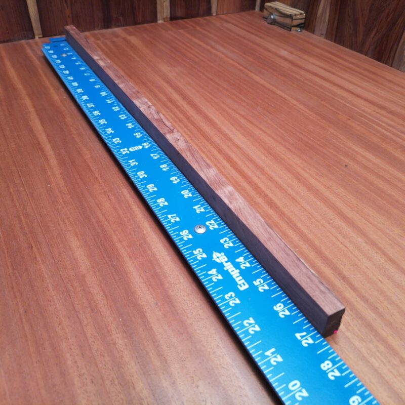 With Honduran Rosewood at your disposal, make everything from custom guitar necks to elegant picture frames - the possibilities are endless! Create stylish plant stands and luxurious drawer pulls, or even a unique knife handle that makes cooking feel like a gourmet affair. Your home decor will never be dull again, and your guests will be green with wood envy! This piece of Honduran Rosewood measures 0.7 inches by 1.2 inches by 27.0 inches, offering a high-quality option for a variety of woodworking projects.