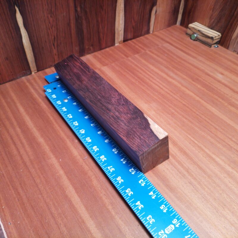 With a versatile piece of Honduran Rosewood, you could create everything from stylish napkin rings to custom guitar necks. Imagine impressing guests with the luxurious elegance of uniquely crafted picture frames or high-end wine stoppers made from your new prized possession. This wood isn’t just a pretty face, it’s ready to turn heads as an artistic bowl or gourmet cutting board in your home! This piece of Honduran Rosewood measures 2.2 inches by 1.9 inches by 12.2 inches, offering a high-quality option for a variety of woodworking projects.