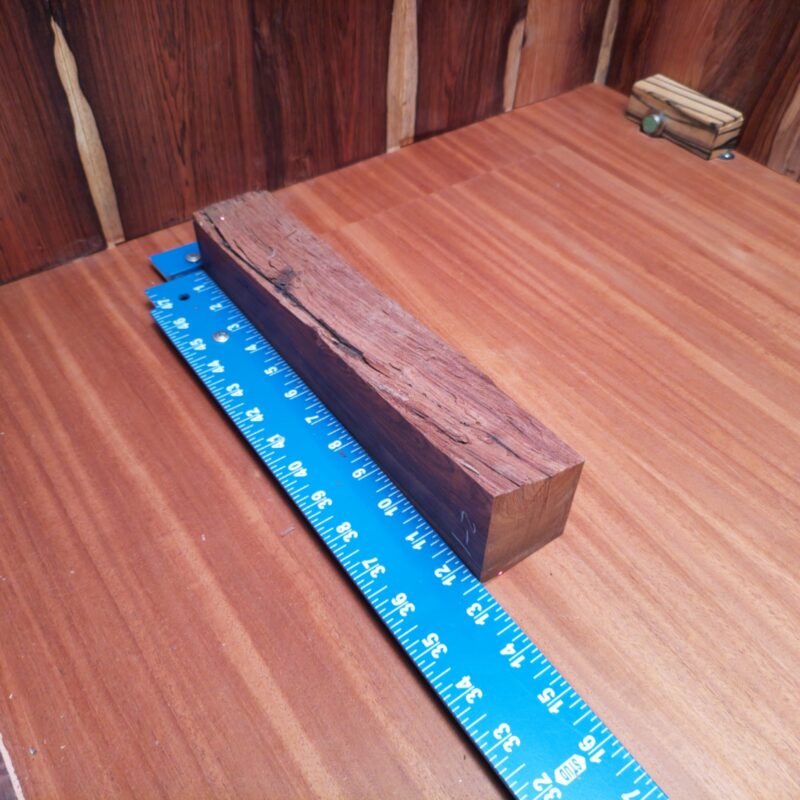 With a versatile piece of Honduran Rosewood, you could create everything from stylish napkin rings to custom guitar necks. Imagine impressing guests with the luxurious elegance of uniquely crafted picture frames or high-end wine stoppers made from your new prized possession. This wood isn’t just a pretty face, it’s ready to turn heads as an artistic bowl or gourmet cutting board in your home! This piece of Honduran Rosewood measures 2.2 inches by 1.9 inches by 12.2 inches, offering a high-quality option for a variety of woodworking projects.