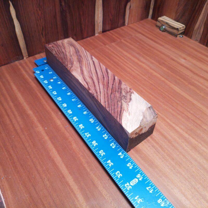 Honduran Rosewood G1 offers endless possibilities! Transform it into a custom guitar pick or elegant furniture handles. Need a high-end decorative piece? Consider a unique napkin holder or luxurious coasters! With so much potential, it’s not just wood; it’s a crafting adventure waiting to happen! This piece of Honduran Rosewood measures 3.1 inches by 2.3 inches by 13.6 inches, offering a high-quality option for a variety of woodworking projects.