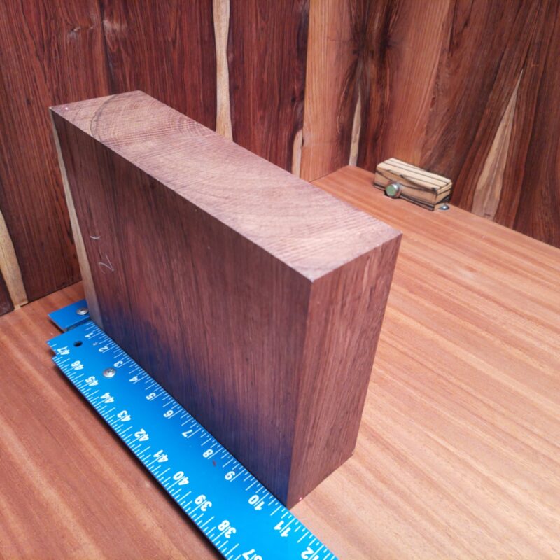 Honduran Rosewood 2.9" X 8.2" X 10.5" Wood Blank for Woodworking Projects - HRDL001149 5 With a piece of Honduran Rosewood, you can transform mundane items into luxury treasures! Imagine high-end picture frames, custom cutting boards, or a unique wine rack all crafted from this stunning wood. Put your favorite beer in a stylish wooden caddy, serve your guests on a charcuterie platter, or impress them with personalized bookmarks. From a sculpted candle holder to handcrafted desk organizers, each piece screams elegance. What can’t it do? This piece of Honduran Rosewood measures 2.9 inches by 8.2 inches by 10.5 inches, offering a high-quality option for a variety of woodworking projects.