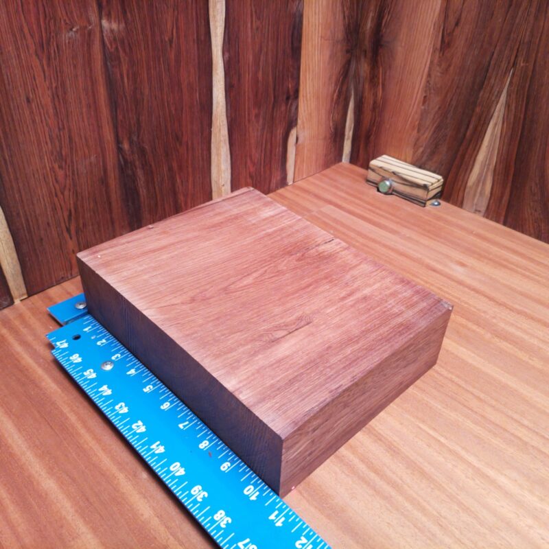 Honduran Rosewood 2.9" X 8.2" X 10.5" Wood Blank for Woodworking Projects - HRDL001149 6 With a piece of Honduran Rosewood, you can transform mundane items into luxury treasures! Imagine high-end picture frames, custom cutting boards, or a unique wine rack all crafted from this stunning wood. Put your favorite beer in a stylish wooden caddy, serve your guests on a charcuterie platter, or impress them with personalized bookmarks. From a sculpted candle holder to handcrafted desk organizers, each piece screams elegance. What can’t it do? This piece of Honduran Rosewood measures 2.9 inches by 8.2 inches by 10.5 inches, offering a high-quality option for a variety of woodworking projects.