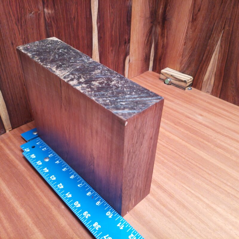 Honduran Rosewood 2.9" X 8.2" X 10.5" Wood Blank for Woodworking Projects - HRDL001149 7 With a piece of Honduran Rosewood, you can transform mundane items into luxury treasures! Imagine high-end picture frames, custom cutting boards, or a unique wine rack all crafted from this stunning wood. Put your favorite beer in a stylish wooden caddy, serve your guests on a charcuterie platter, or impress them with personalized bookmarks. From a sculpted candle holder to handcrafted desk organizers, each piece screams elegance. What can’t it do? This piece of Honduran Rosewood measures 2.9 inches by 8.2 inches by 10.5 inches, offering a high-quality option for a variety of woodworking projects.