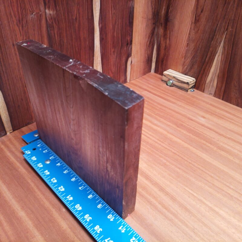 Imagine a luxury jewelry box that opens to reveal your finest gems, or a custom guitar body that sings in perfect harmony! With the stunning potential of Honduran Rosewood, you’ve got everything from high-end drawer pulls to elegant picture frames and unique serving trays. It’s time to let your creativity flow like a fine wine in a bespoke wine rack! This piece of Honduran Rosewood measures 1.1 inches by 8.6 inches by 10.5 inches, offering a high-quality option for a variety of woodworking projects.