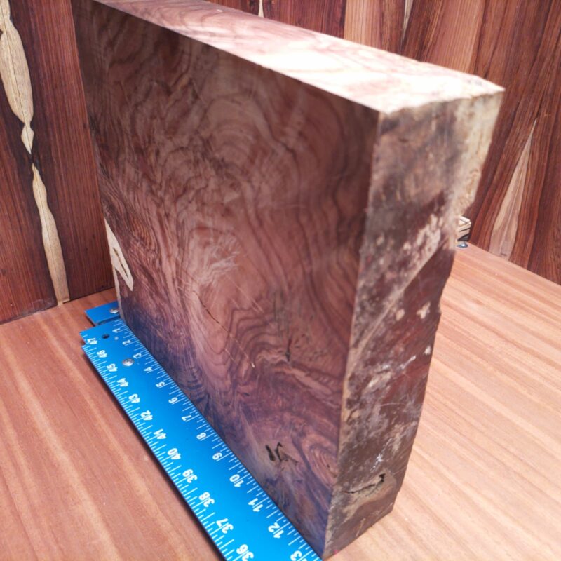 Honduran Rosewood 2.7" X 12.8" X 13.3" Wood Blank for Woodworking Projects - HRDL001154 5 Imagine turning this Honduran Rosewood into a luxury serving board or a stylish phone stand. You could go all out and sculpt an artistic wizard figurine, or keep it functional with a high-end knife block. With this beautiful wood, even your coasters will become works of art, because why should your drinks be the only ones getting the royal treatment? This piece of Honduran Rosewood measures 2.7 inches by 12.8 inches by 13.3 inches, offering a high-quality option for a variety of woodworking projects.