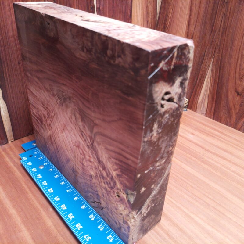 Honduran Rosewood 2.7" X 12.8" X 13.3" Wood Blank for Woodworking Projects - HRDL001154 7 Imagine turning this Honduran Rosewood into a luxury serving board or a stylish phone stand. You could go all out and sculpt an artistic wizard figurine, or keep it functional with a high-end knife block. With this beautiful wood, even your coasters will become works of art, because why should your drinks be the only ones getting the royal treatment? This piece of Honduran Rosewood measures 2.7 inches by 12.8 inches by 13.3 inches, offering a high-quality option for a variety of woodworking projects.