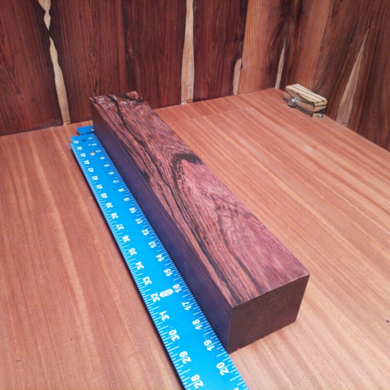 Unleash your creativity with Honduran Rosewood! Imagine stylish drawer pulls, luxurious coasters, or an avant-garde sculpture that steals the show! Whether it’s a modern lamp base or a unique chess set, this wood reinvents functionality with flair. Your home decor will feel like a gallery, and you might start inviting friends over just to showcase your wooden wonders! This piece of Honduran Rosewood measures 2.9 inches by 3.2 inches by 19.3 inches, offering a high-quality option for a variety of woodworking projects.