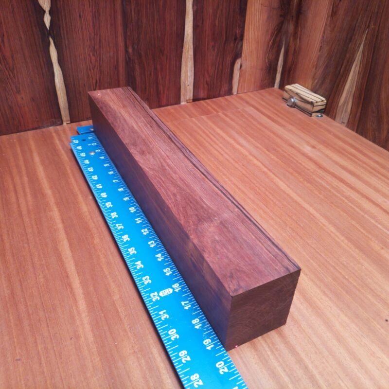 Honduran Rosewood 2.9" X 3.2" X 19.3" Wood Blank for Woodworking Projects - HRDL001160 7 Unleash your creativity with Honduran Rosewood! Imagine stylish drawer pulls, luxurious coasters, or an avant-garde sculpture that steals the show! Whether it’s a modern lamp base or a unique chess set, this wood reinvents functionality with flair. Your home decor will feel like a gallery, and you might start inviting friends over just to showcase your wooden wonders! This piece of Honduran Rosewood measures 2.9 inches by 3.2 inches by 19.3 inches, offering a high-quality option for a variety of woodworking projects.