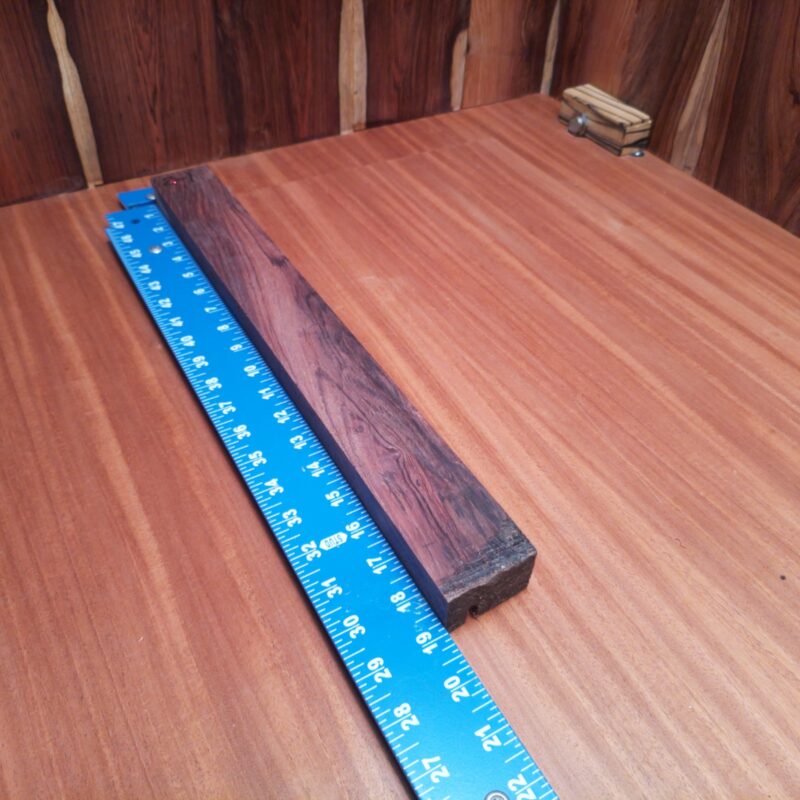 Dimensional Lumber 157 Transform a simple piece of wood into luxurious drawer pulls or a custom guitar neck! Why not get crafty with decorative coasters or elegant wine stoppers? With this high-end Honduran Rosewood, your creativity could turn ordinary spaces into extraordinary places, giggling all the while as you make those stylish candle holders! It’s like adding a touch of nature’s elegance to your life—let’s wood it up! This piece of Honduran Rosewood measures 1.1 inches by 1.1 inches by 18.7 inches, offering a high-quality option for a variety of woodworking projects.