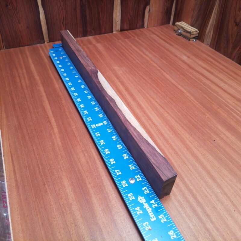 Honduran Rosewood 1.1" X 2.2" X 23.6" Wood Blank for Woodworking Projects - HRDL001182 5 With a piece of Honduran Rosewood, the possibilities are endless! Imagine a chic serving tray that will elevate your kitchen, or a stunning picture frame that holds your precious memories in style. Why not also craft unique bookends or a stylish lamp base to brighten up any nook? From elegant door handles to high-end candle holders, let your creativity shine through as you turn this wood into functional art! This piece of Honduran Rosewood measures 1.1 inches by 2.2 inches by 23.6 inches, offering a high-quality option for a variety of woodworking projects.