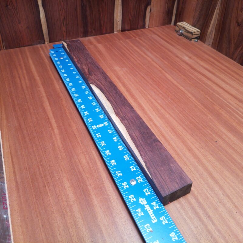 Honduran Rosewood 1.1" X 2.2" X 23.6" Wood Blank for Woodworking Projects - HRDL001182 6 With a piece of Honduran Rosewood, the possibilities are endless! Imagine a chic serving tray that will elevate your kitchen, or a stunning picture frame that holds your precious memories in style. Why not also craft unique bookends or a stylish lamp base to brighten up any nook? From elegant door handles to high-end candle holders, let your creativity shine through as you turn this wood into functional art! This piece of Honduran Rosewood measures 1.1 inches by 2.2 inches by 23.6 inches, offering a high-quality option for a variety of woodworking projects.