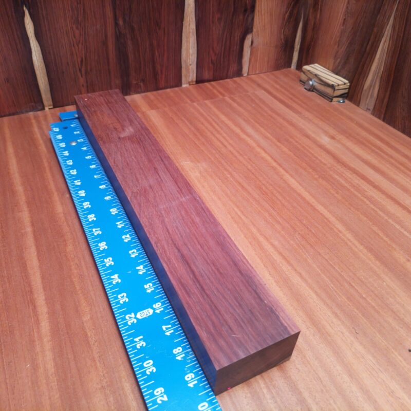 Honduran Rosewood brings class to your home! Create luxury drawer pulls, a custom guitar neck, or a unique serving platter that will have your guests asking for more. The beautiful grains can shape artistic photo frames and whimsical coasters, making everything feel high-end, even that spoon rest! With such versatile dimensions, furniture and decor options are plentiful, making this wood feel like a celebrity among its peers! This piece of Honduran Rosewood measures 1.7 inches by 2.8 inches by 19.6 inches, offering a high-quality option for a variety of woodworking projects.