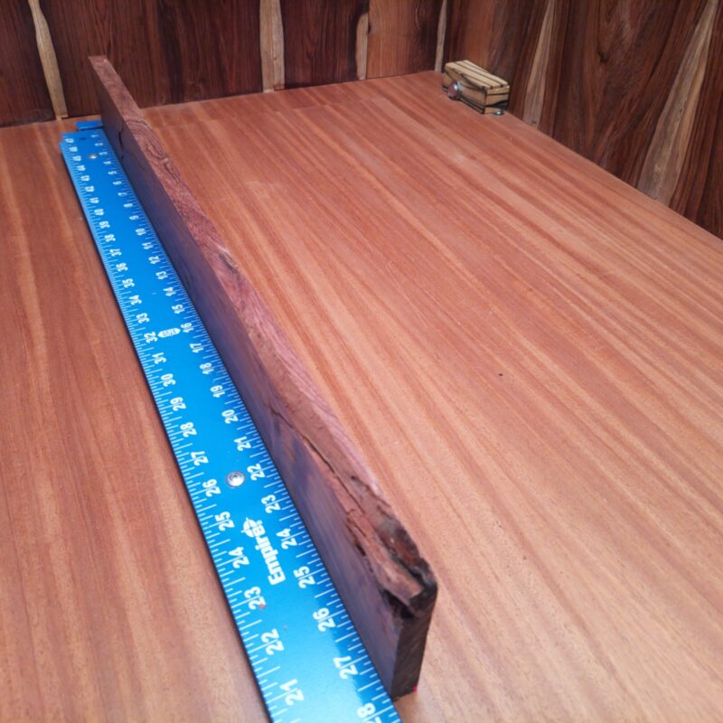 Honduran Rosewood 0.7" X 3.2" X 27.6" Wood Blank for Woodworking Projects - HRDL001188 5 Discover the endless possibilities of Honduran Rosewood! Transform those splinters into high-end drawer pulls, ornate picture frames, or a luxurious charcuterie board that even your cheese can appreciate. Picture elegant bookends, rustic candle holders, and a unique set of custom guitar necks—perfect for all musicians with a flair for style! This piece of Honduran Rosewood measures 0.7 inches by 3.2 inches by 27.6 inches, offering a high-quality option for a variety of woodworking projects.
