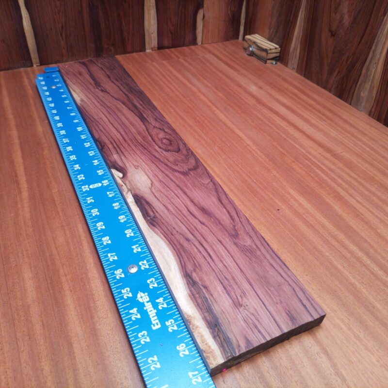 Honduran Rosewood 0.7" X 4.7" X 26.9" Wood Blank for Woodworking Projects - HRDL001194 6 With Honduran Rosewood, transform your life into a luxury magnet! Create a stylish cutting board for gourmet meals, chic planter boxes bursting with greenery, or even elegant picture frames that showcase your best moments. Feeling artistic? Whip up some distinctive wall art or a unique souvenir box to impress friends. Just remember, wood loves to be loved – and this beauty will turn heads! This piece of Honduran Rosewood measures 0.7 inches by 4.7 inches by 26.9 inches, offering a high-quality option for a variety of woodworking projects.