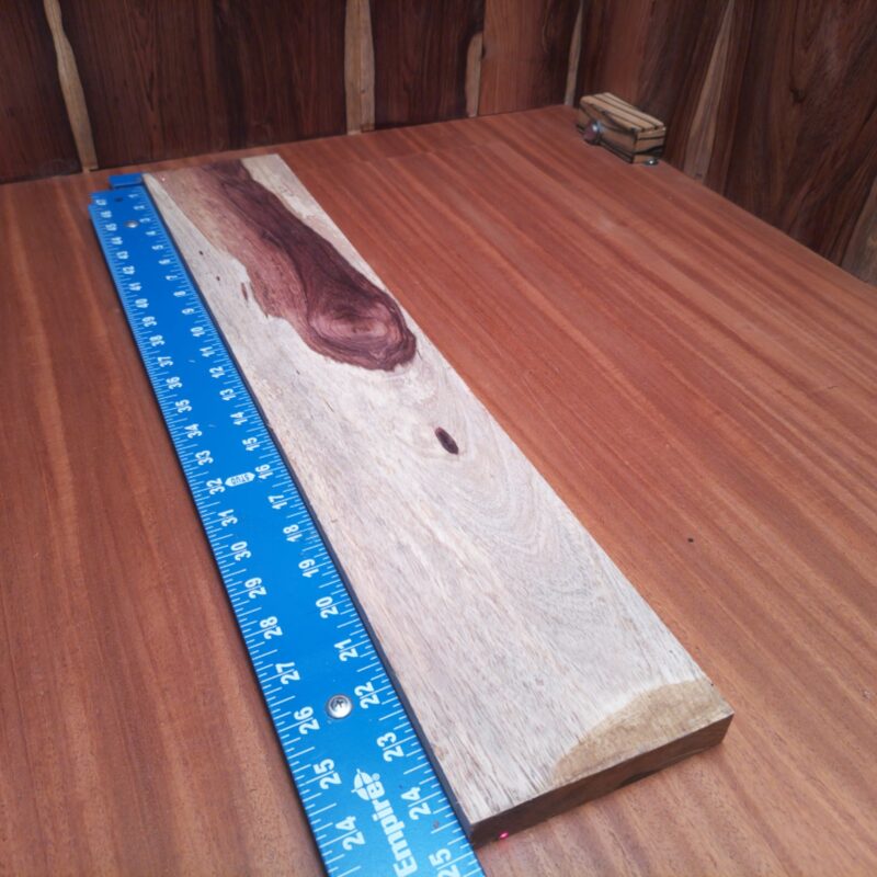 Honduran Rosewood 0.6" X 4.7" X 24.7" Wood Blank for Woodworking Projects - HRDL001195 6 Transform that Honduran Rosewood into a show-stopping guitar body inlay or high-end coasters for your next gathering. Why not whip up some stylish serving trays or elegant bookends while you're at it? This wood is so versatile, it could even make your dreams of custom drawer pulls a reality. Because let’s be honest, who doesn’t love a good wooden spoon action? This piece of Honduran Rosewood measures 0.6 inches by 4.7 inches by 24.7 inches, offering a high-quality option for a variety of woodworking projects.