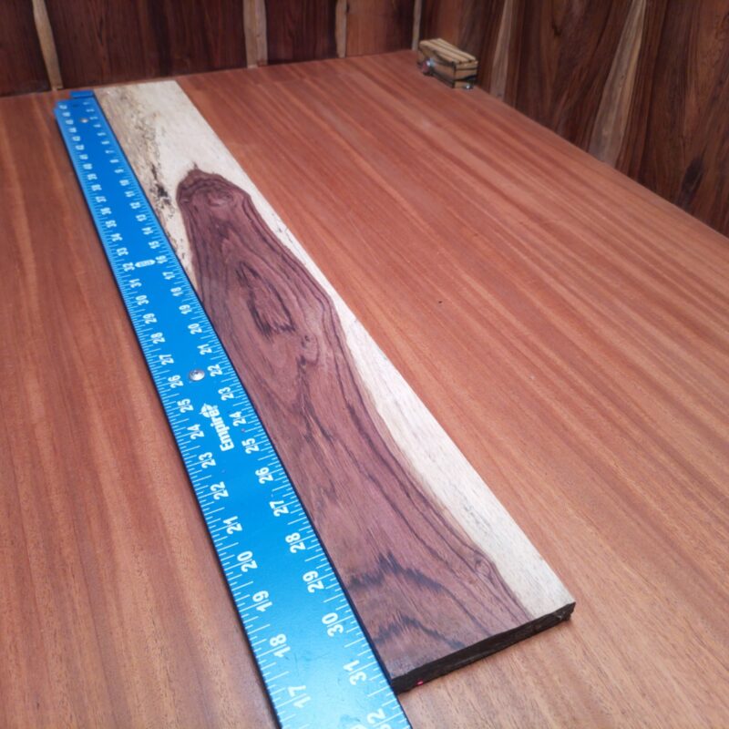Looking to elevate your decor? Transform Honduran Rosewood into a custom guitar neck or a luxury serving tray! Whether you’re crafting sleek picture frames or elegant napkin holders, the only limit is your imagination—and your woodshop! Each piece is just waiting to become that high-end decorative touch you never knew you needed! This piece of Honduran Rosewood measures 0.5 inches by 3.8 inches by 31.6 inches, offering a high-quality option for a variety of woodworking projects.