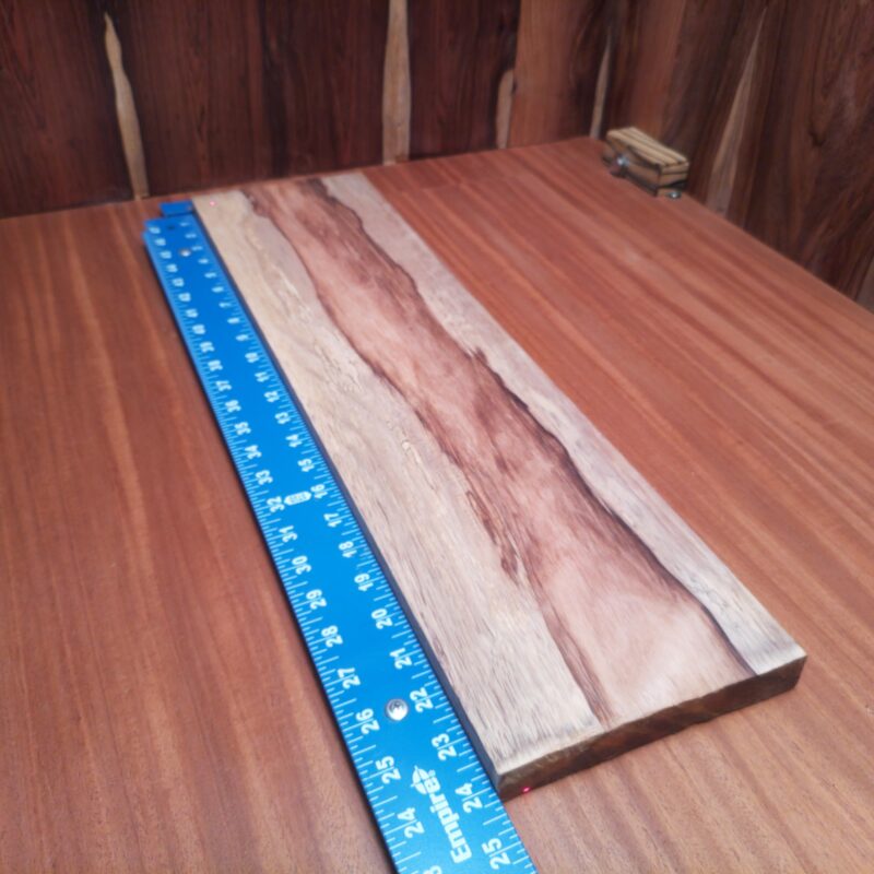 Imagine a world where you can have a custom guitar body and a luxury drawer front—made from the exact same piece of wood. Honduran Rosewood is like the Swiss Army knife of materials, bringing elegance to picture frames, artistic sculptures, and even stylish office desk organizers, all made possible by its glorious dimensions! This piece of Honduran Rosewood measures 0.8 inches by 6.5 inches by 24.3 inches, offering a high-quality option for a variety of woodworking projects.