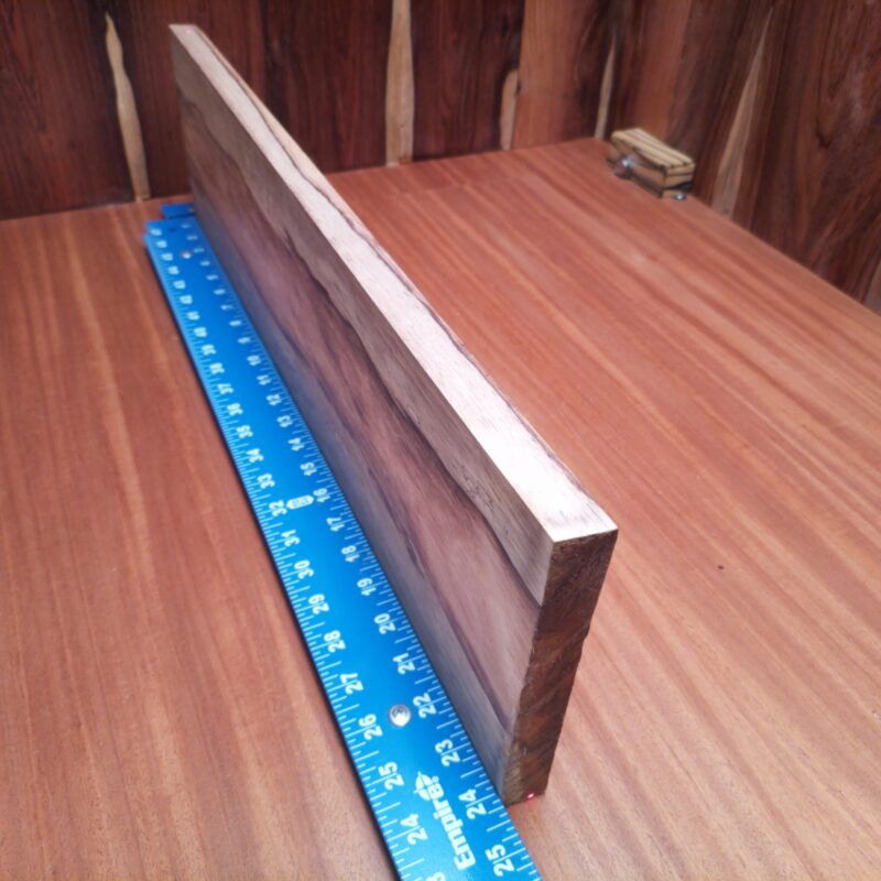 Imagine a world where you can have a custom guitar body and a luxury drawer front—made from the exact same piece of wood. Honduran Rosewood is like the Swiss Army knife of materials, bringing elegance to picture frames, artistic sculptures, and even stylish office desk organizers, all made possible by its glorious dimensions! This piece of Honduran Rosewood measures 0.8 inches by 6.5 inches by 24.3 inches, offering a high-quality option for a variety of woodworking projects.