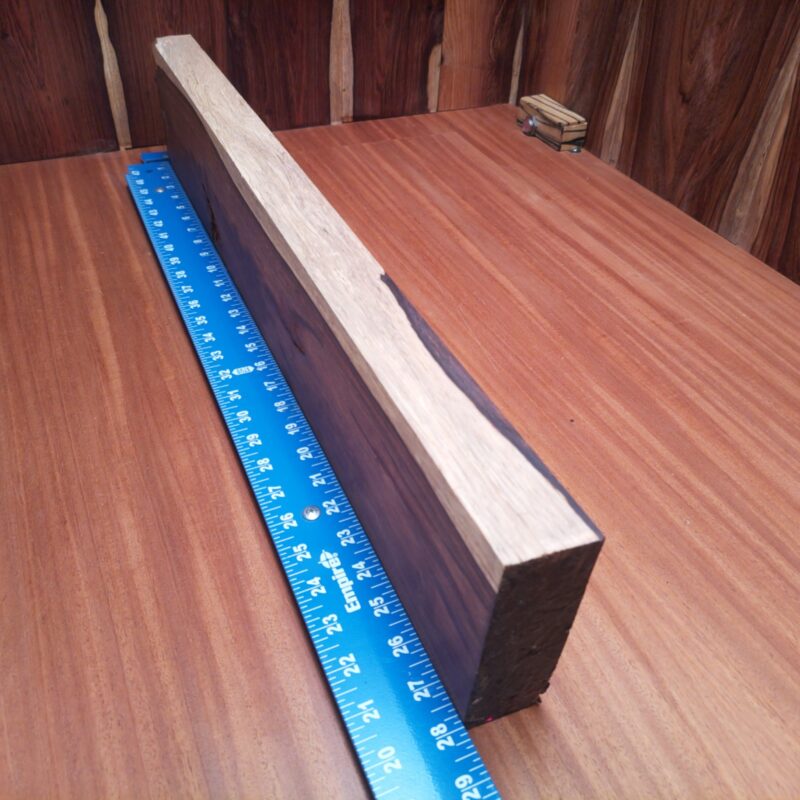 Honduran Rosewood 1.5" X 5.1" X 27.9" Wood Blank for Woodworking Projects - HRDL001216 5 Transform your Honduran Rosewood into a stunning customized guitar body, a unique jewelry box, or an elegant serving tray! With these luscious dimensions, your wood can be an artistic table centerpiece or stylish knife handle. Who knew such a versatile piece could make everything from rustic picture frames to bespoke drawer dividers? You'll have guests wondering if you hired a magician or a master woodworker! This piece of Honduran Rosewood measures 1.5 inches by 5.1 inches by 27.9 inches, offering a high-quality option for a variety of woodworking projects.