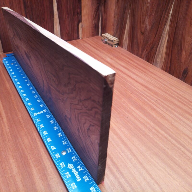 Honduran Rosewood 0.7" X 7.7" X 26.3" Wood Blank for Woodworking Projects - HRDL001226 5 Who knew a piece of wood could be so versatile? With Honduran Rosewood, you could whip up a custom guitar body, craft chic coasters, or finally build that stylish desk organizer you've been dreaming about! Perfect for anything from table legs to sophisticated wall art, this elegant wood can turn your creative ideas into luxurious reality – with a touch of whimsy, of course! This piece of Honduran Rosewood measures 0.7 inches by 7.7 inches by 26.3 inches, offering a high-quality option for a variety of woodworking projects.