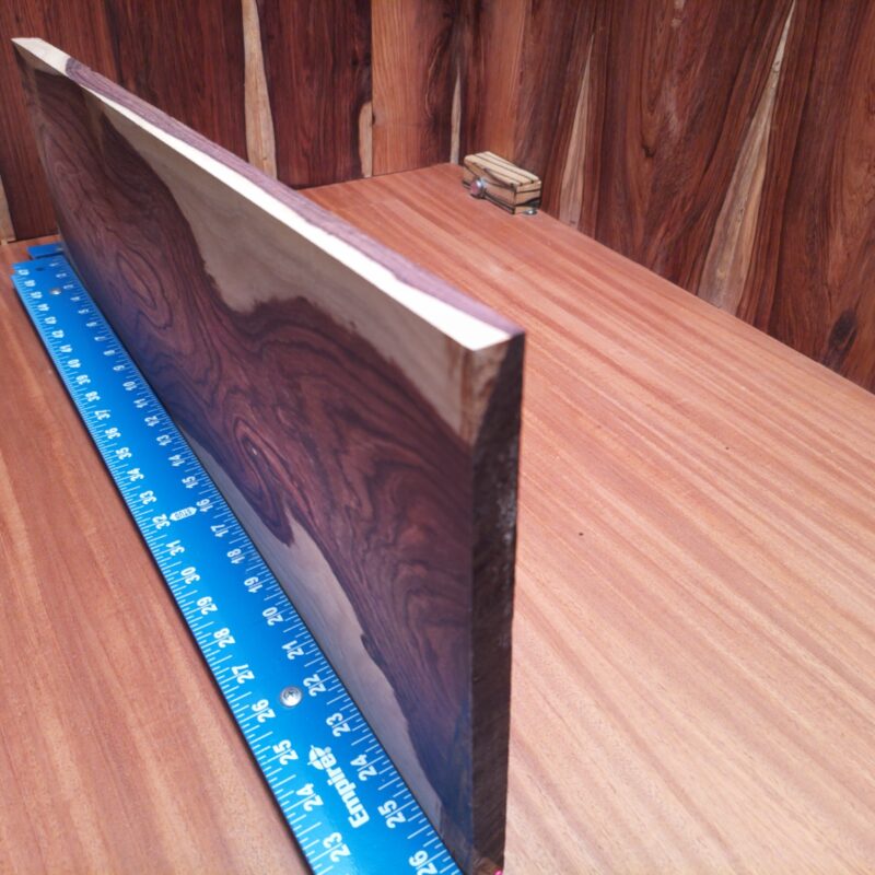 Honduran Rosewood 0.7" X 7.7" X 26.3" Wood Blank for Woodworking Projects - HRDL001226 7 Who knew a piece of wood could be so versatile? With Honduran Rosewood, you could whip up a custom guitar body, craft chic coasters, or finally build that stylish desk organizer you've been dreaming about! Perfect for anything from table legs to sophisticated wall art, this elegant wood can turn your creative ideas into luxurious reality – with a touch of whimsy, of course! This piece of Honduran Rosewood measures 0.7 inches by 7.7 inches by 26.3 inches, offering a high-quality option for a variety of woodworking projects.
