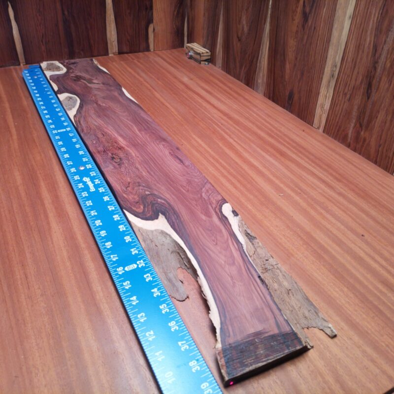 Dimensional Lumber 144 From elegant jewelry boxes to unique kitchen utensils, this Honduran Rosewood is practically begging to shine. Imagine crafting a stunning custom guitar body or an artistic table centerpiece – your wildest ideas! Whether you favor premium cutting boards or rustic bar tops, the possibilities are endless (and a little nutty!). Turn that gorgeous piece of wood into a statement furniture leg or custom drawer front. Let's make wood dreams come true! This piece of Honduran Rosewood measures 0.7 inches by 6.0 inches by 39.0 inches, offering a high-quality option for a variety of woodworking projects.