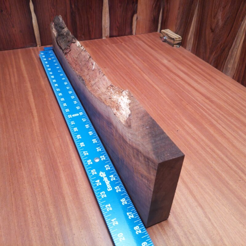 Koa 1.5" X 4.1" X 27.7" Wood Blank for Woodworking Projects - KODL001220 5 This stunning Koa masterpiece awaits your imagination! Create a custom chopping board, a unique wine rack, or even a stylish coat rack. Not only does it bring elegance, but it also adds humor to your decor. Who knew a wood-turned vessel could be as chic as a fancy fashion accessory? Bring home a slice of nature's finest to make mundane objects like napkin holders and birdhouses totally envious! This piece of Koa measures 1.5 inches by 4.1 inches by 27.7 inches, offering a high-quality option for a variety of woodworking projects.