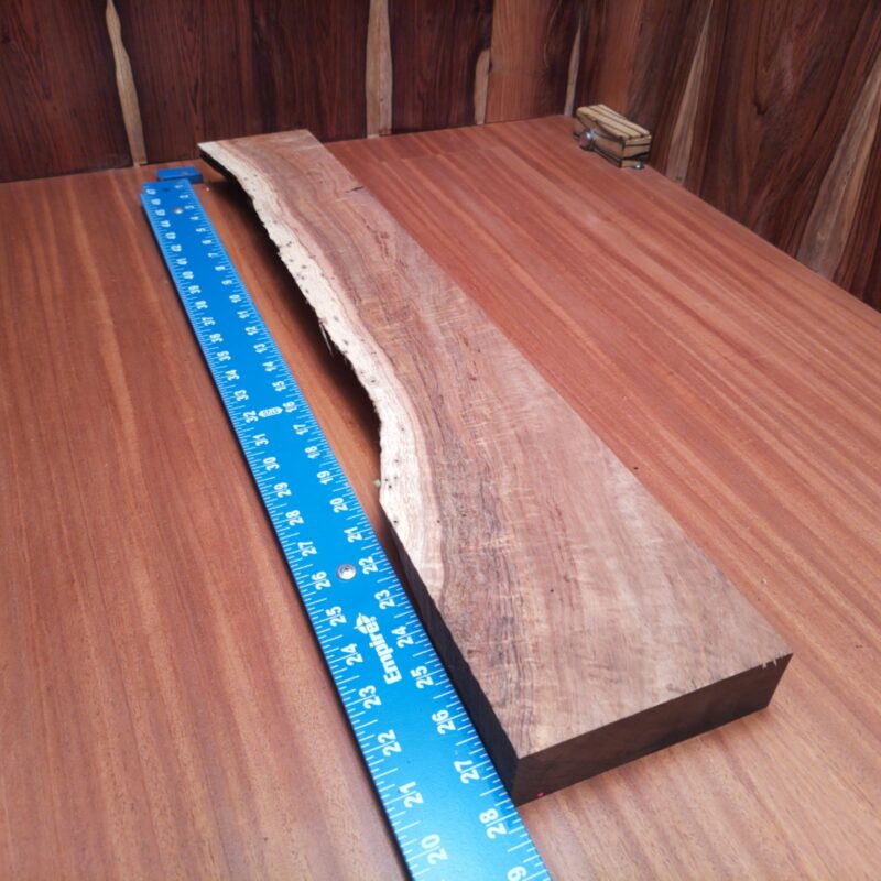 Koa 1.5" X 4.1" X 27.7" Wood Blank for Woodworking Projects - KODL001220 6 This stunning Koa masterpiece awaits your imagination! Create a custom chopping board, a unique wine rack, or even a stylish coat rack. Not only does it bring elegance, but it also adds humor to your decor. Who knew a wood-turned vessel could be as chic as a fancy fashion accessory? Bring home a slice of nature's finest to make mundane objects like napkin holders and birdhouses totally envious! This piece of Koa measures 1.5 inches by 4.1 inches by 27.7 inches, offering a high-quality option for a variety of woodworking projects.