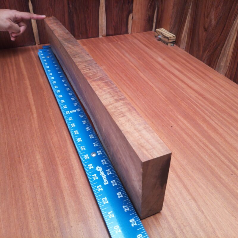 Koa 1.5" X 4.1" X 27.7" Wood Blank for Woodworking Projects - KODL001220 7 This stunning Koa masterpiece awaits your imagination! Create a custom chopping board, a unique wine rack, or even a stylish coat rack. Not only does it bring elegance, but it also adds humor to your decor. Who knew a wood-turned vessel could be as chic as a fancy fashion accessory? Bring home a slice of nature's finest to make mundane objects like napkin holders and birdhouses totally envious! This piece of Koa measures 1.5 inches by 4.1 inches by 27.7 inches, offering a high-quality option for a variety of woodworking projects.