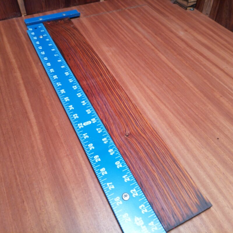 Crafted from premium Mexican Cocobolo, this fingerboard blank offers unmatched tonal richness and sustain. Perfect for luthiers seeking to enhance their acoustic instruments with exotic hardwood. Its quarter-sawn cut ensures stability and superior grain patterns, making it an ideal choice for your next guitar project. Get ready to elevate your craftsmanship with this visually striking and sonically powerful fingerboard blank! It is a Mexican Cocobolo Acoustic Quarter Sawn fingerboard blank with dimensions of 23.6 x 3.0 x 0.3 inches.