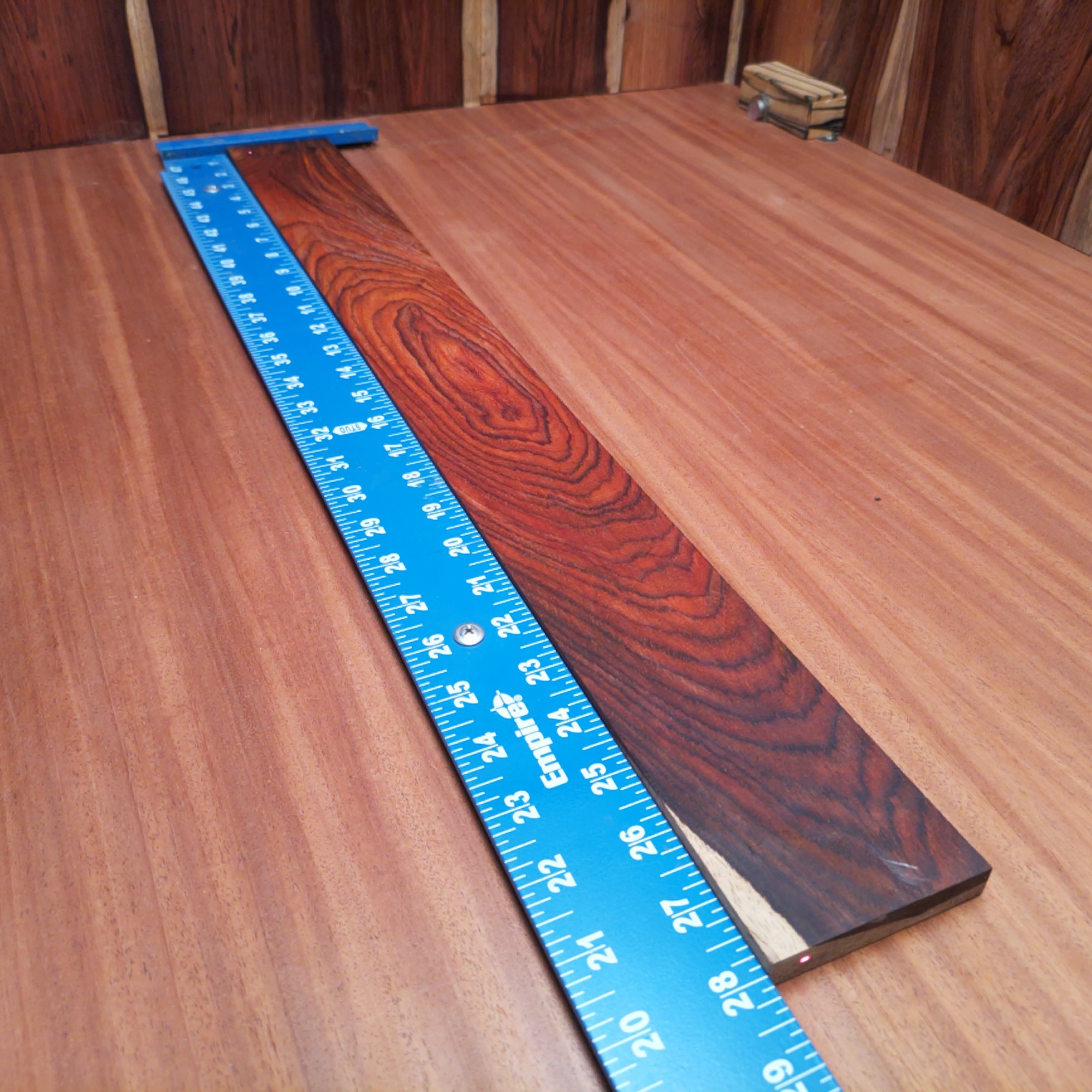Mexican Cocobolo Bass Flat Sawn Fingerboard Blank 0.5" X 3.0" X 28.0" - MCBFBF000006 1 Unlock the potential of sound with this Mexican Cocobolo bass fingerboard blank. Perfectly engineered, this versatile flat sawn wood enhances resonance and sustain for your instruments. The rich, warm tones of Cocobolo provide a stunning finish that will leave both luthiers and players impressed. Elevate your craft and create a masterpiece that's as beautiful as it is functional. It is a Mexican Cocobolo Bass Flat Sawn fingerboard blank with dimensions of 28.0 x 3.0 x 0.5 inches.