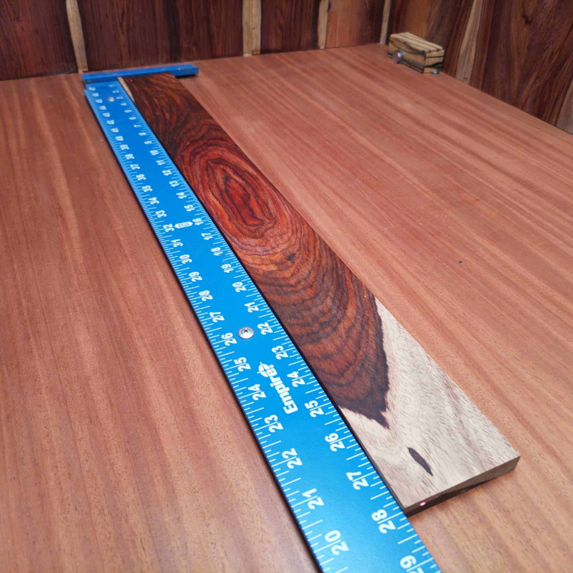 Mexican Cocobolo Bass Flat Sawn Fingerboard Blank 0.5" X 3.0" X 28.0" - MCBFBF000006 2 Unlock the potential of sound with this Mexican Cocobolo bass fingerboard blank. Perfectly engineered, this versatile flat sawn wood enhances resonance and sustain for your instruments. The rich, warm tones of Cocobolo provide a stunning finish that will leave both luthiers and players impressed. Elevate your craft and create a masterpiece that's as beautiful as it is functional. It is a Mexican Cocobolo Bass Flat Sawn fingerboard blank with dimensions of 28.0 x 3.0 x 0.5 inches.