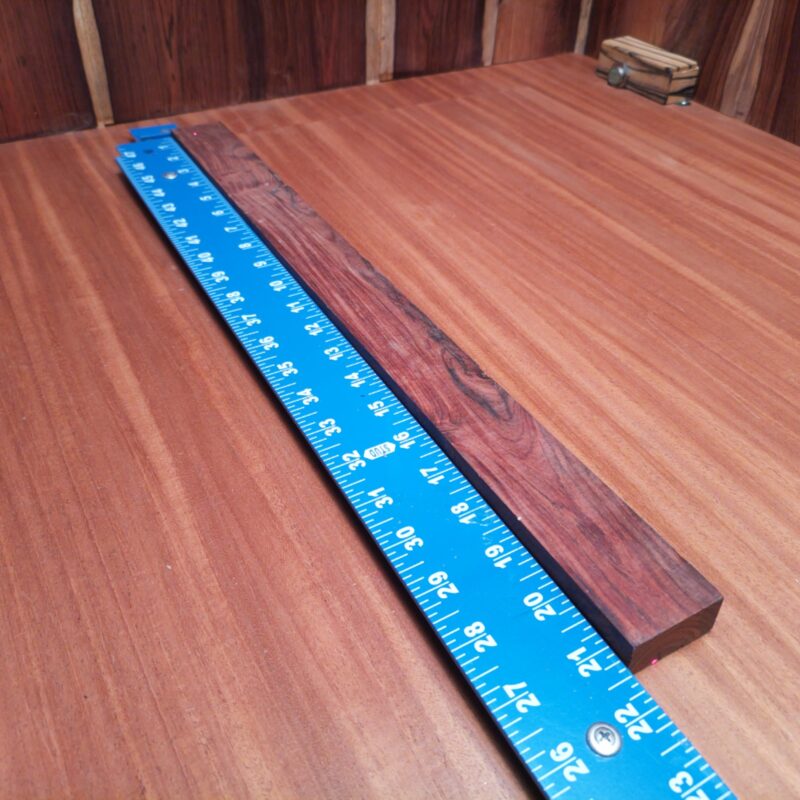 Mexican Cocobolo, oh what a fine specimen! This beauty can be turned into everything from a custom guitar neck to decorative coasters that speak volumes! If you’re dreaming of unique drawer pulls or high-end knife handles, this wood has got your back (and your kitchen). Picture this: artistic wall sculptures that leave your guests questioning your impeccable taste, or whimsical garden markers to add flair to your plants! This piece of Mexican Cocobolo measures 0.5 inches by 1.6 inches by 21.2 inches, offering a high-quality option for a variety of woodworking projects.