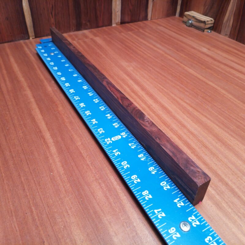 Mexican Cocobolo, oh what a fine specimen! This beauty can be turned into everything from a custom guitar neck to decorative coasters that speak volumes! If you’re dreaming of unique drawer pulls or high-end knife handles, this wood has got your back (and your kitchen). Picture this: artistic wall sculptures that leave your guests questioning your impeccable taste, or whimsical garden markers to add flair to your plants! This piece of Mexican Cocobolo measures 0.5 inches by 1.6 inches by 21.2 inches, offering a high-quality option for a variety of woodworking projects.