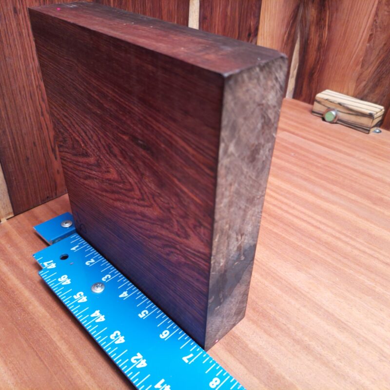 Discover the possibilities of Mexican Cocobolo with wonders like unique drawer pulls and handcrafted birdhouses. Elevate your game with high-end tablet stands and elegant serving trays that'll have dinner guests talking. With a bit of creativity, you could even make bespoke guitar necks or stylish wooden phone cases. Who knew wood could be so chique? This piece of Mexican Cocobolo measures 1.7 inches by 8.1 inches by 6.9 inches, offering a high-quality option for a variety of woodworking projects.