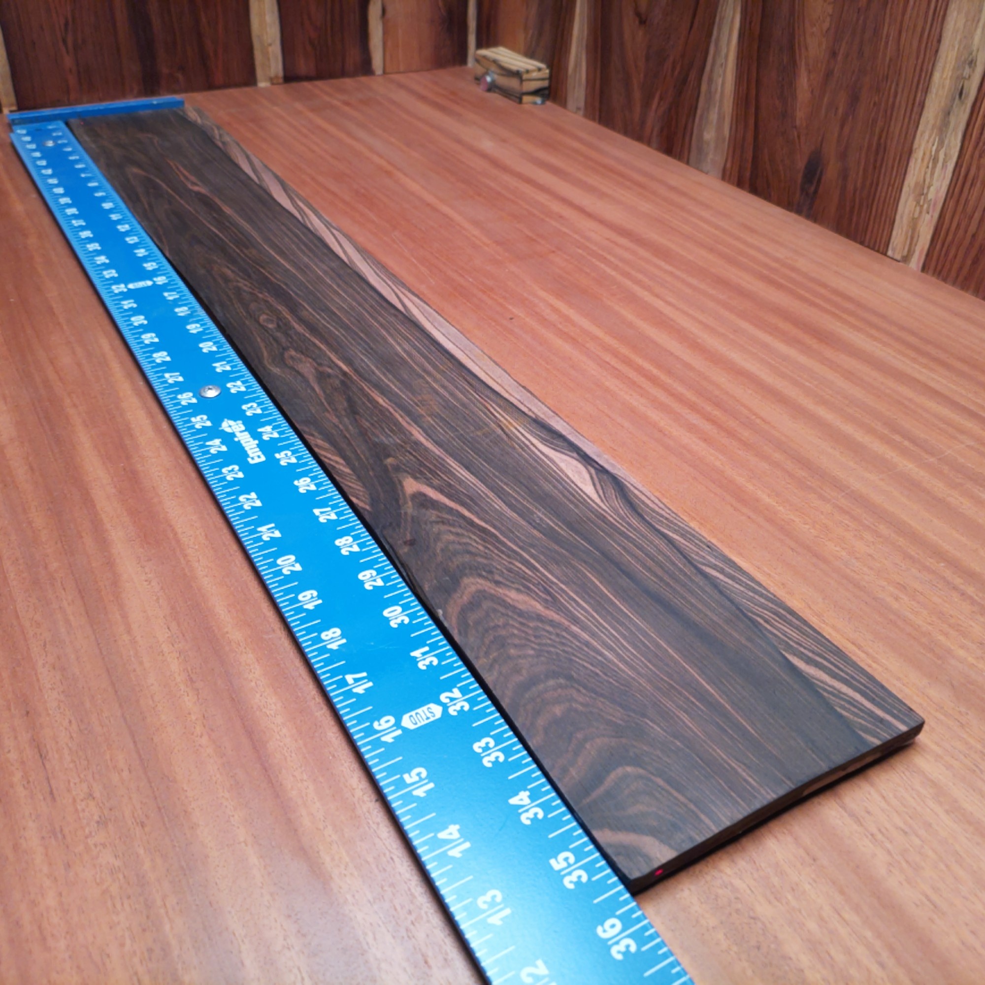 Mun Ebony Bass Quarter Sawn Fingerboard Blank 0.3" X 5.1" X 35.7" - MEBFBQ000011 1 Elevate your bass instrument game with our premium Mun Ebony blank. Perfectly quarter-sawn for optimal stability, this blank features deep hues and rich tones that enhance resonance. Ideal for luthiers looking to create stunning bass guitars or add a touch of luxury to their builds, it matches durability with aesthetic appeal. Grab yours and start shaping the sound of the next musical masterpiece! It is a Mun Ebony Bass Quarter Sawn fingerboard blank with dimensions of 35.7 x 5.1 x 0.3 inches.